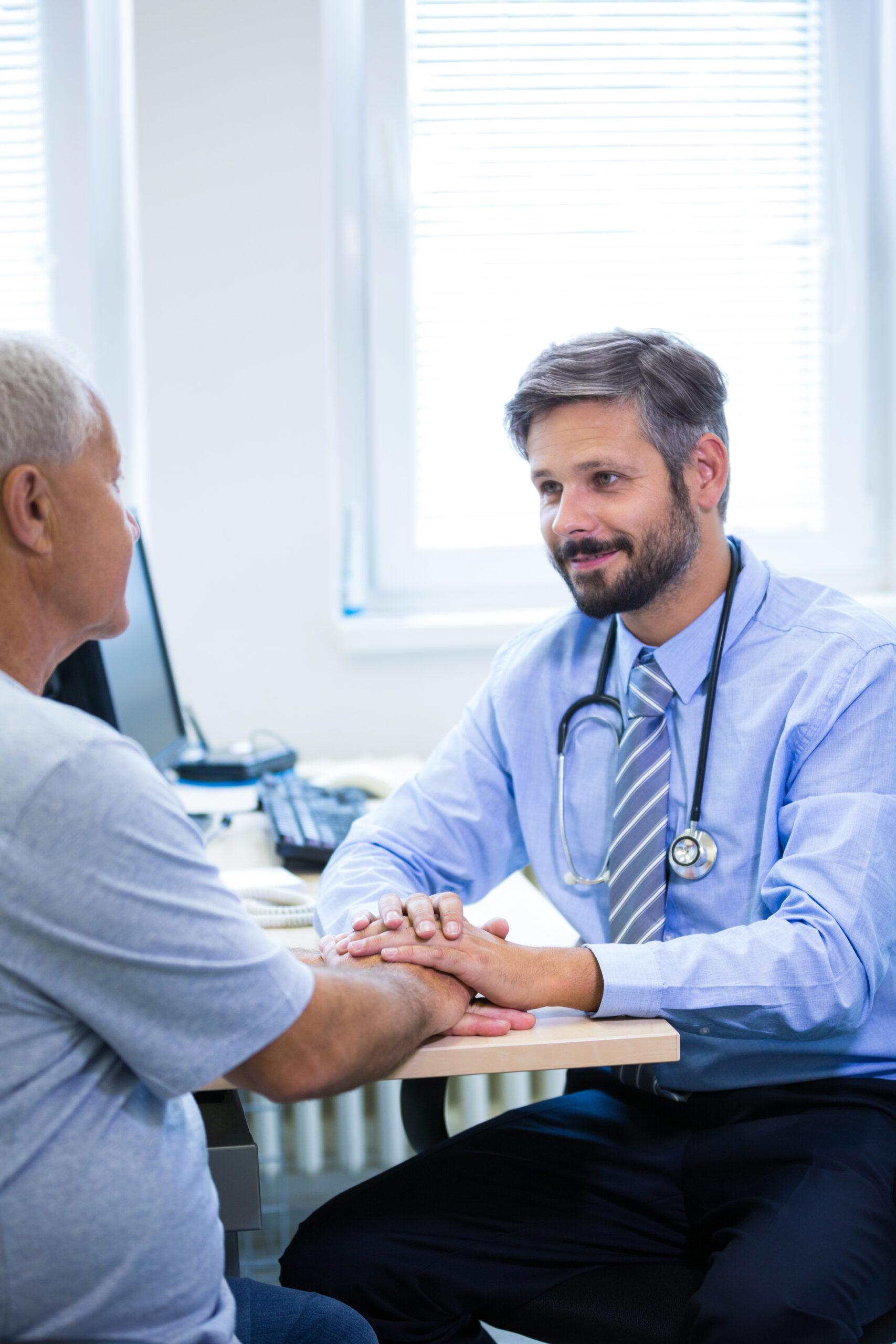 male doctor examining a patient
